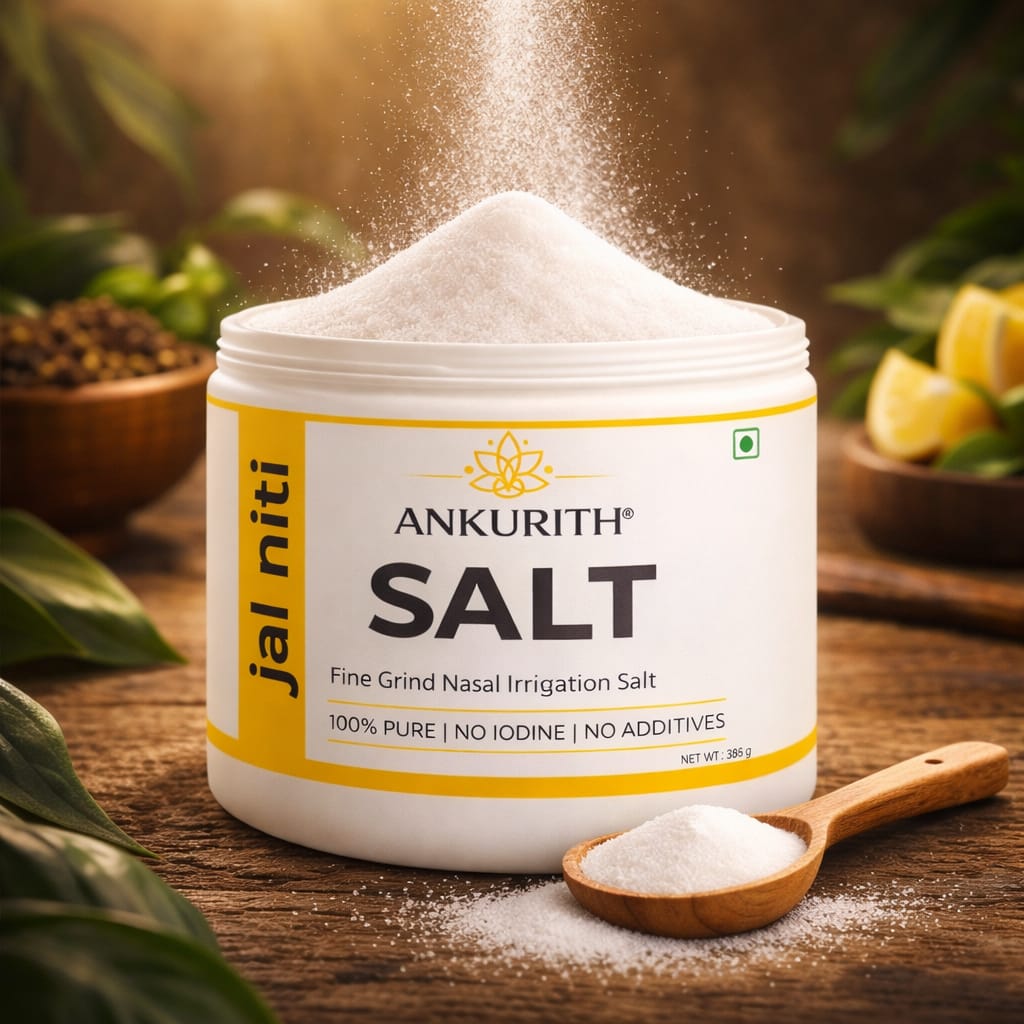 Fine Ankurith Jal Neti Salt pouring into the jar, surrounded by fresh herbs